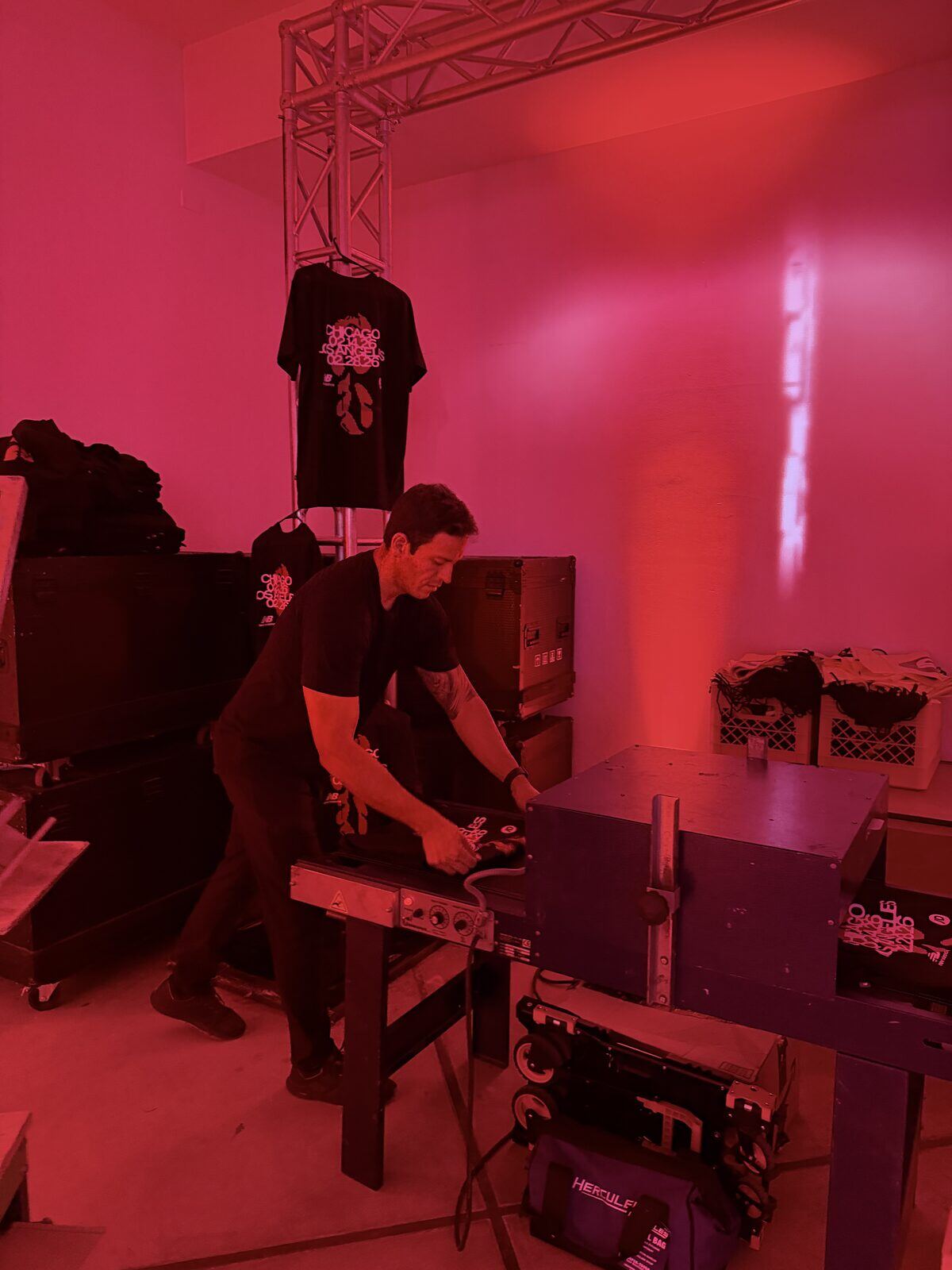 Operator running a live heat press station at an event