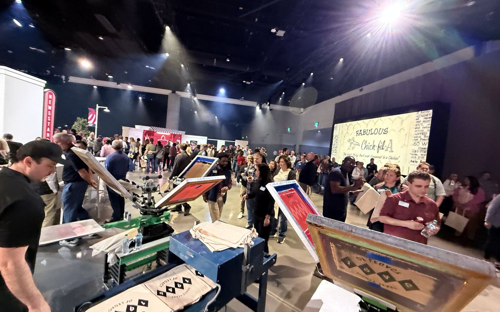 Corporate live printing setup with branded shirts on display